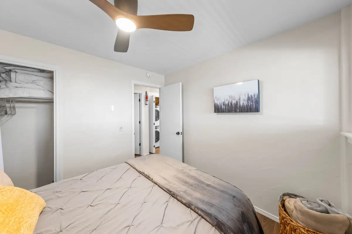 Bedroom with a bed, ceiling fan and open closet, Lakeview Haven in Incline Village
