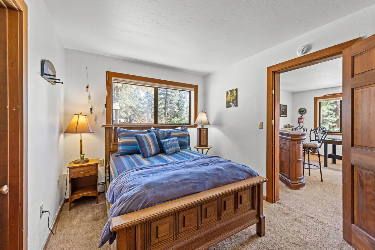 Bedroom with a bed and blue bedding, Rustic Ridge Retreat
