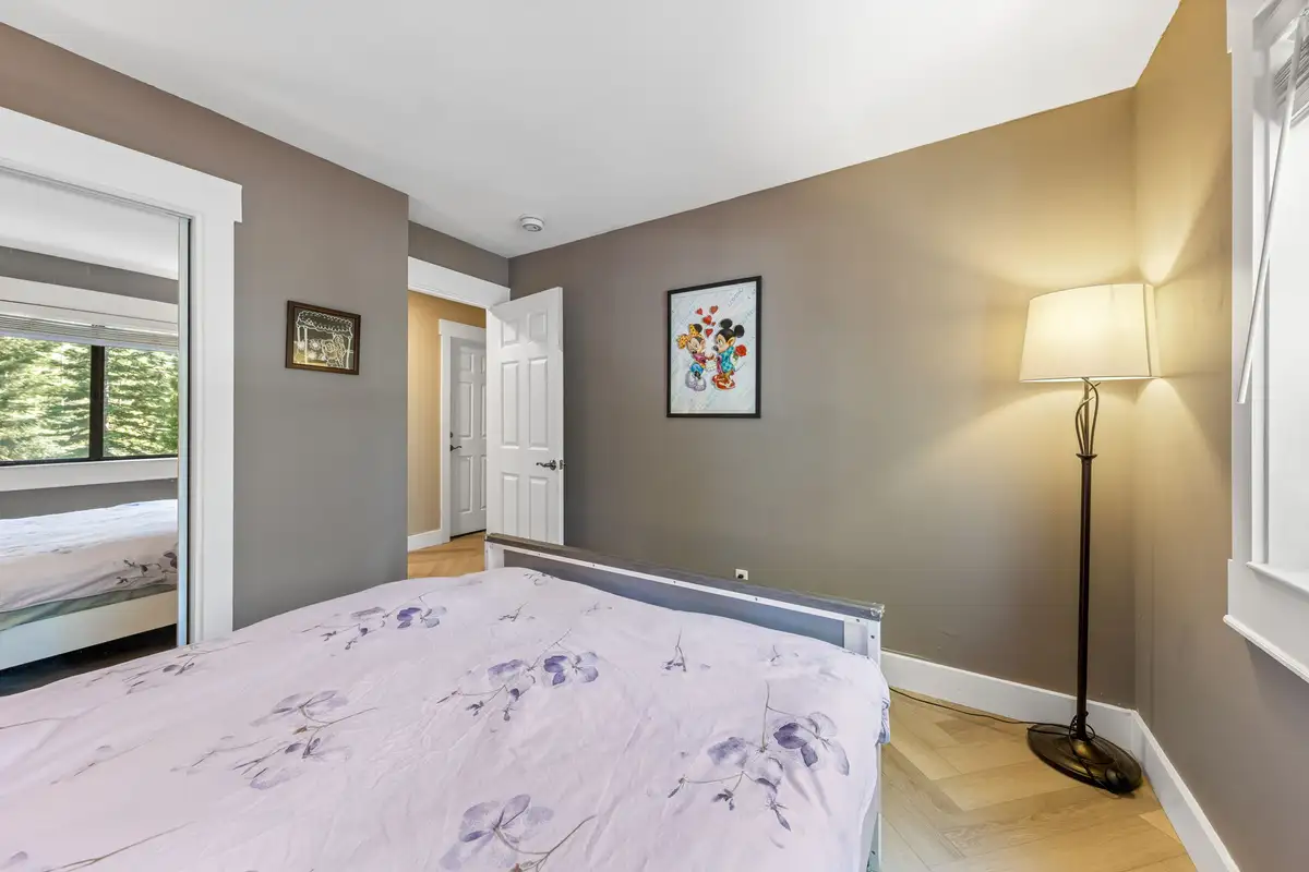 Bedroom with a bed, floor lamp and mirrored closet, Tranquil Stay