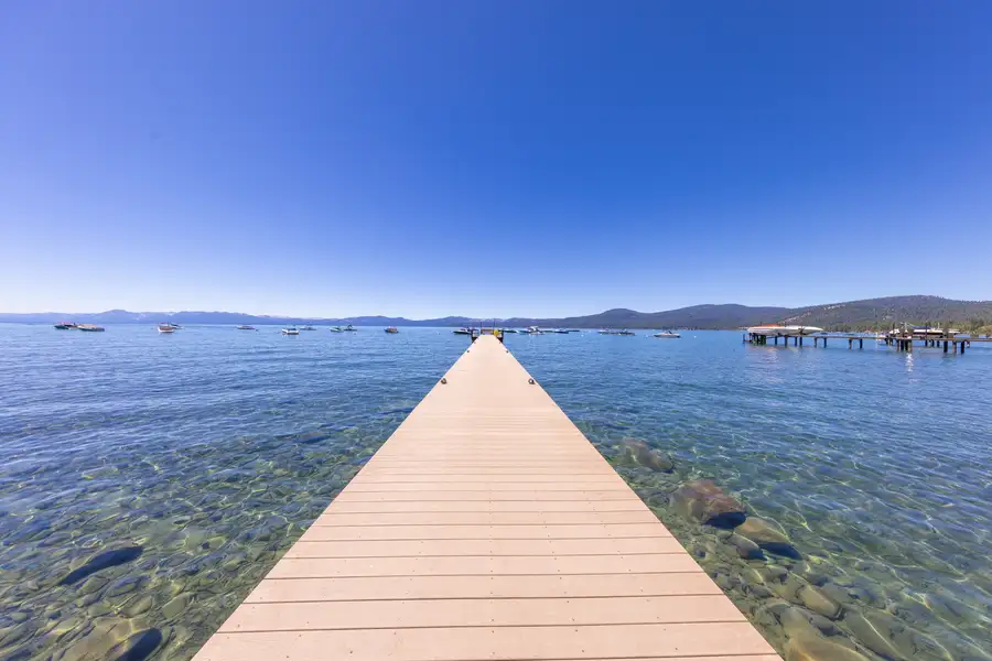 Pier stretching into clear Lake Tahoe water, Lakeside Luxe Retreat