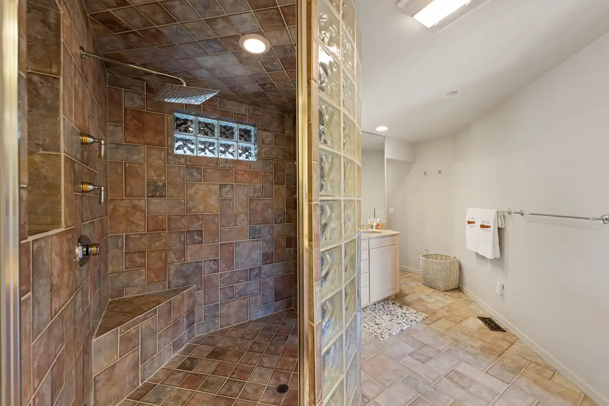 Bathroom with tiled walk-in shower and glass block wall, Incline Lakeside Haven