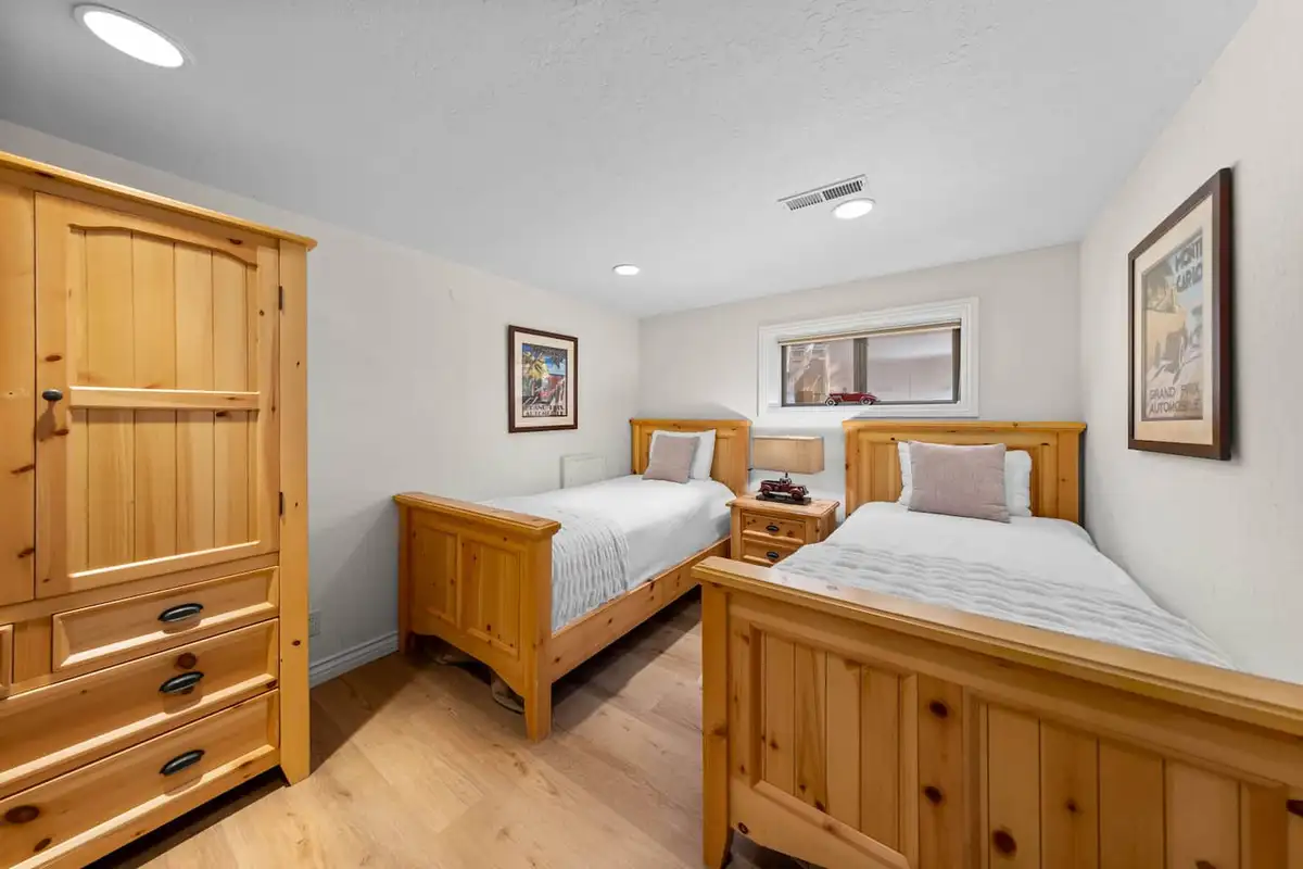 Bedroom with two twin beds and a pine armoire, Tranquil Alpine Bliss
