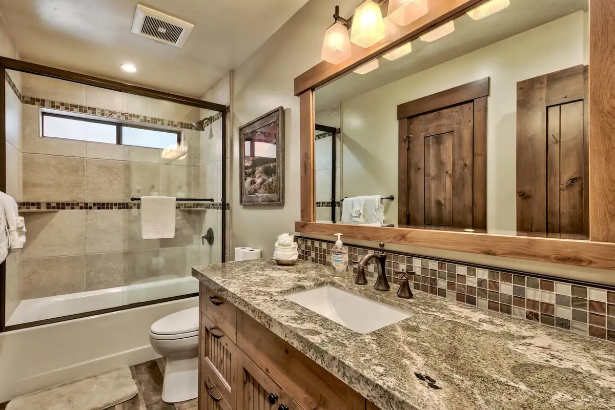 Bathroom with granite vanity and tub with shower, Mammoth Haven Retreat