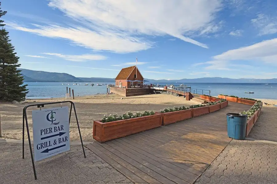 Beach boardwalk leading to a pier bar on Lake Tahoe, Enchanting Chamberlands Cabin