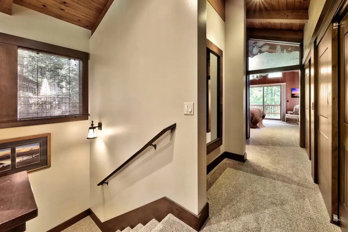 Stair landing with a hallway leading to a bedroom, Mammoth Haven Retreat