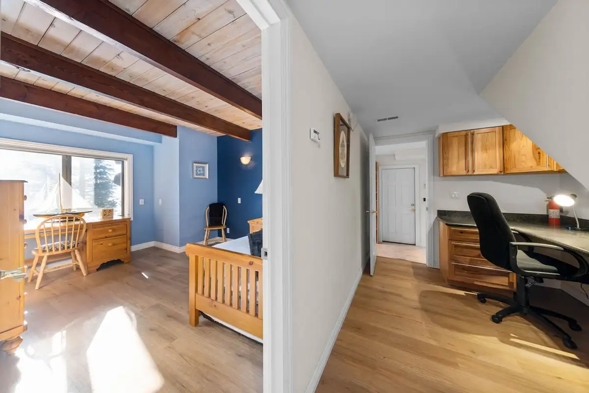 Bedroom with a desk area and beamed wood ceiling, Tranquil Alpine Bliss