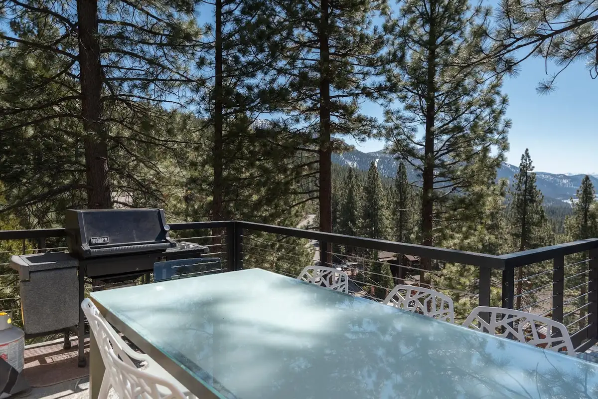 Deck with a grill and glass table among pines and mountains, Skylake Serenity Retreat