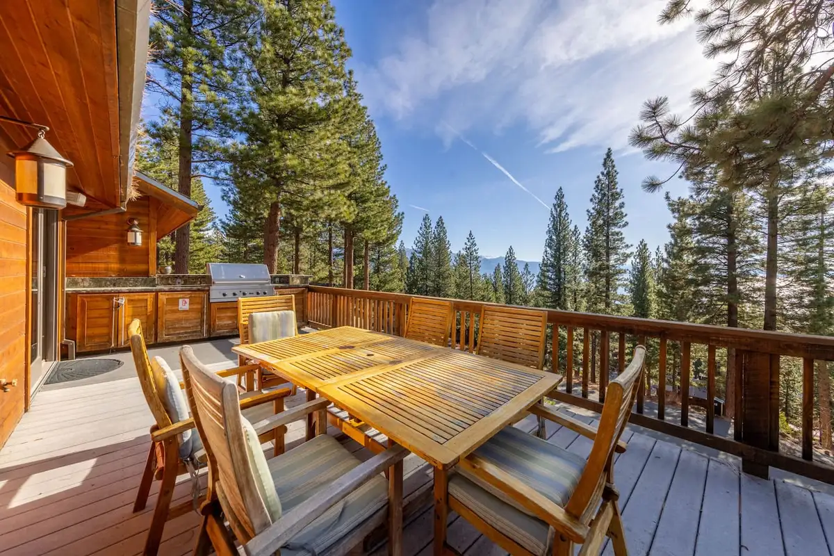 Deck with a wood dining table, grill and forest views, Tranquil Alpine Bliss