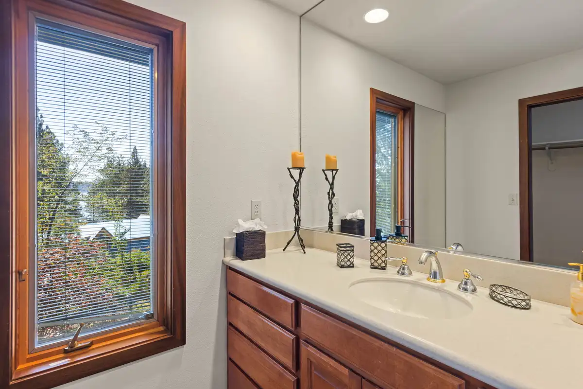 Bathroom vanity with a large mirror and window, Incline Lakeside Haven