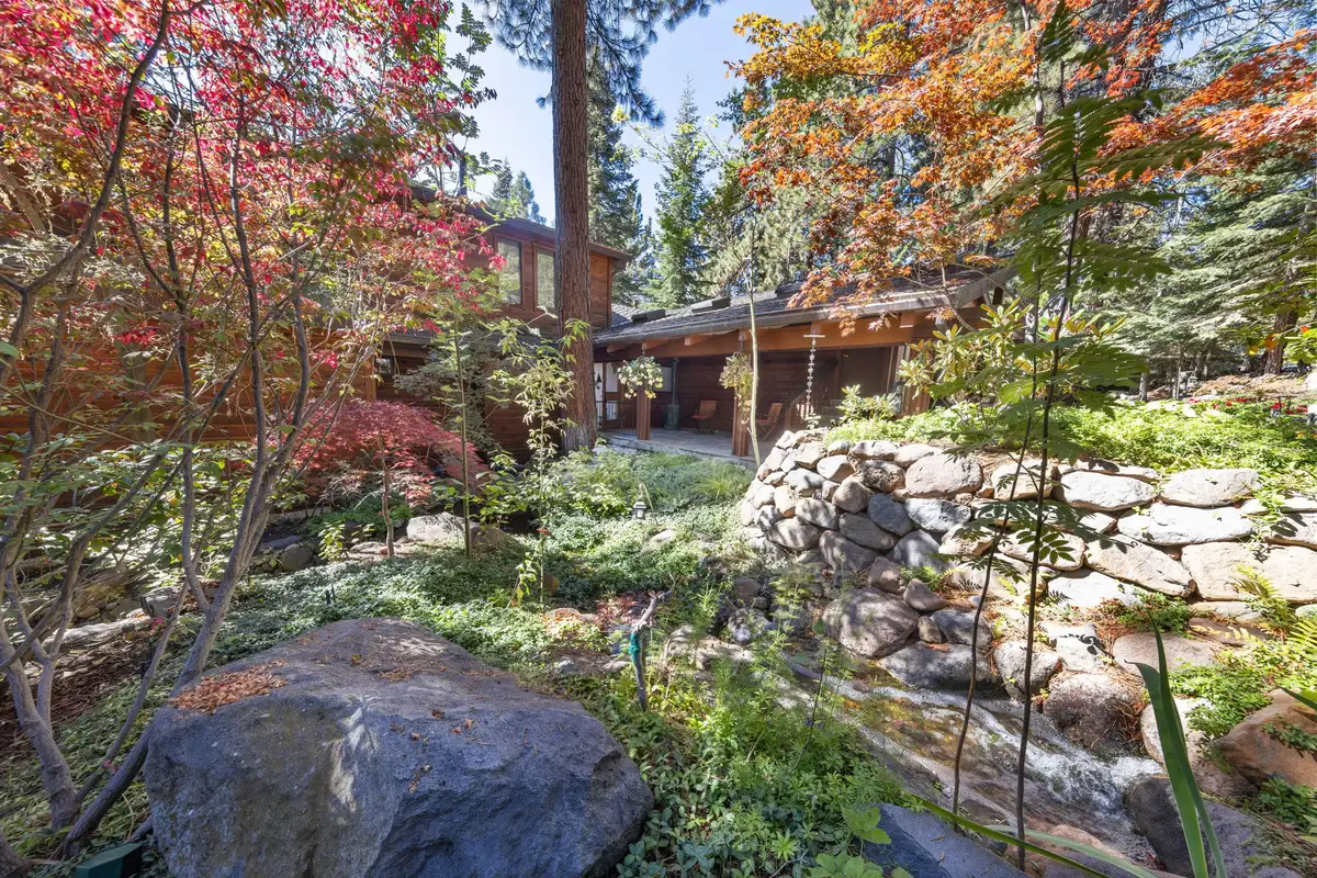 Garden with red maples, boulders and the house beyond, Incline Lakeside Haven