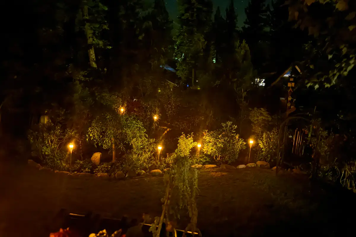Garden lit by path lights at night, Incline Lakeside Haven