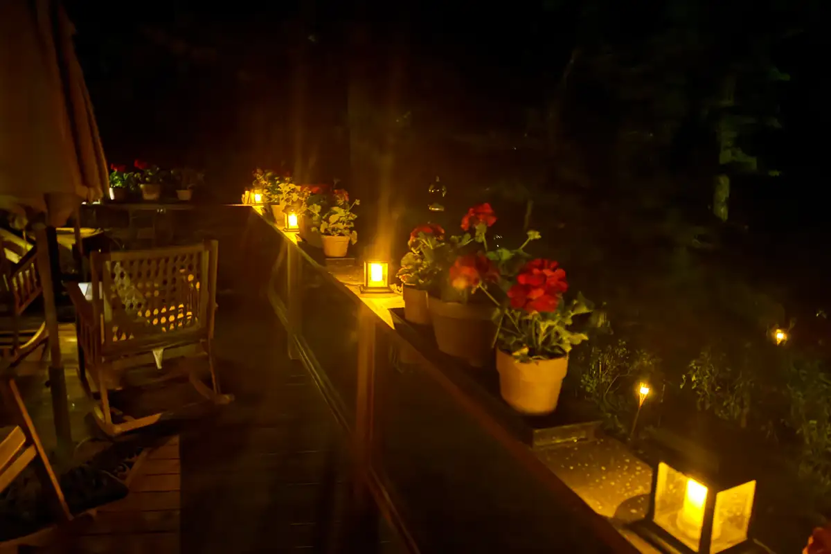 Deck at night with lanterns and potted flowers, Incline Lakeside Haven