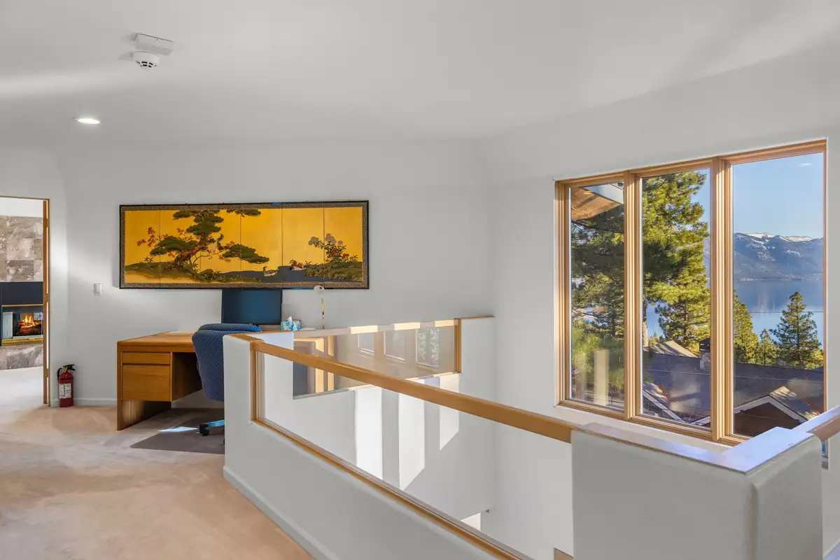 Upstairs landing with desk and Lake Tahoe visible through windows, 90s Tahoe Time Capsule