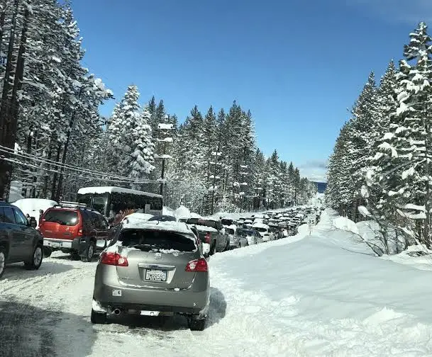 Cars parked along a snowy road near Heavenly